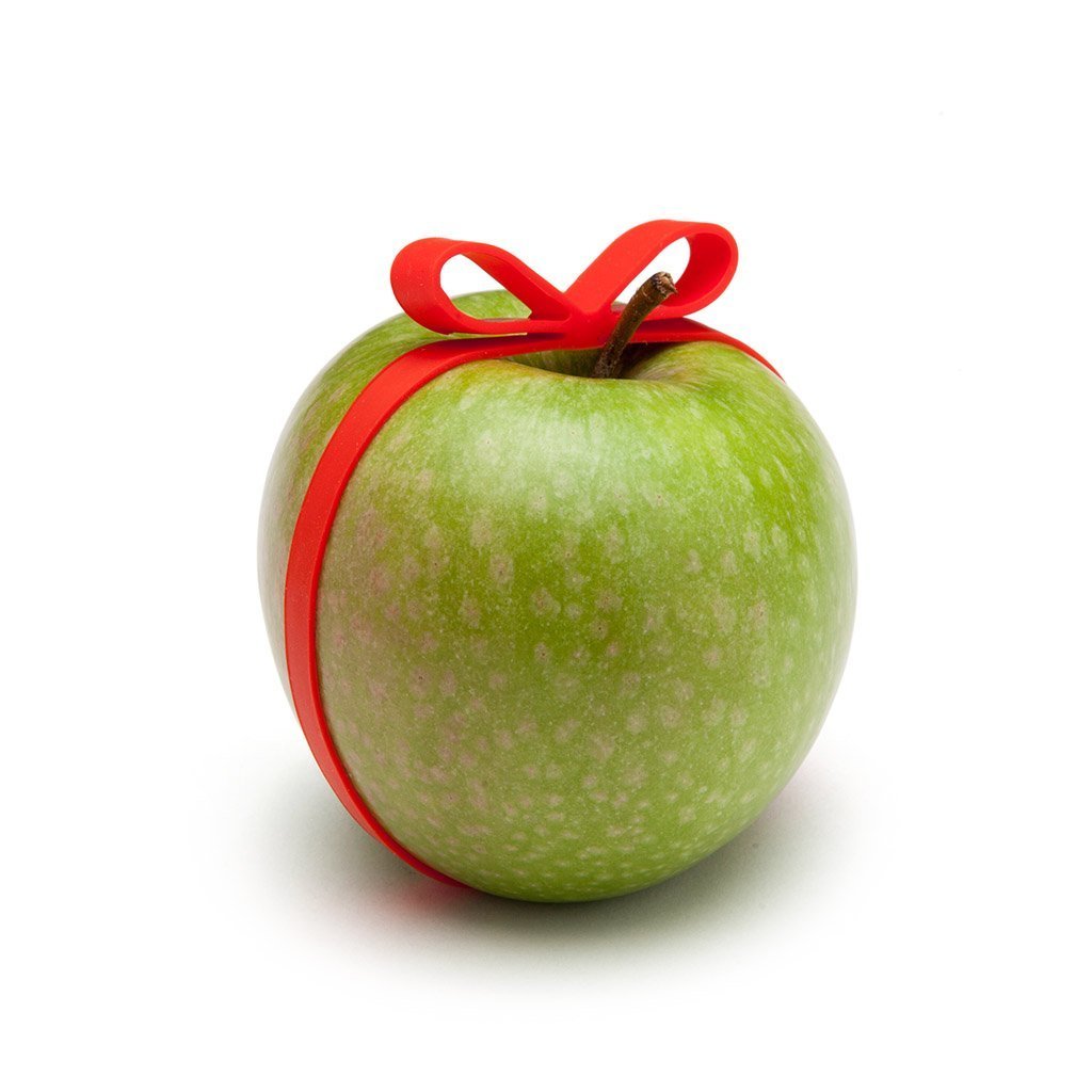 Gifted wrapping bands in bright red on a green appel by  Monkey Business