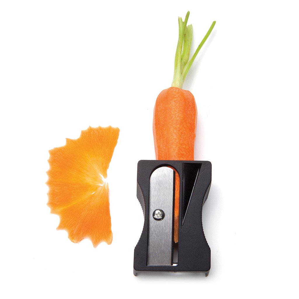 Karoto  Gray peeler making carrot curls on a kitchen counter