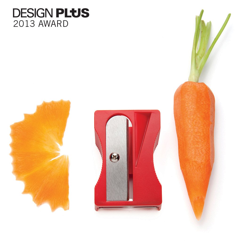 Red Pencil-style veggie peeler shaping vegetables into ribbons